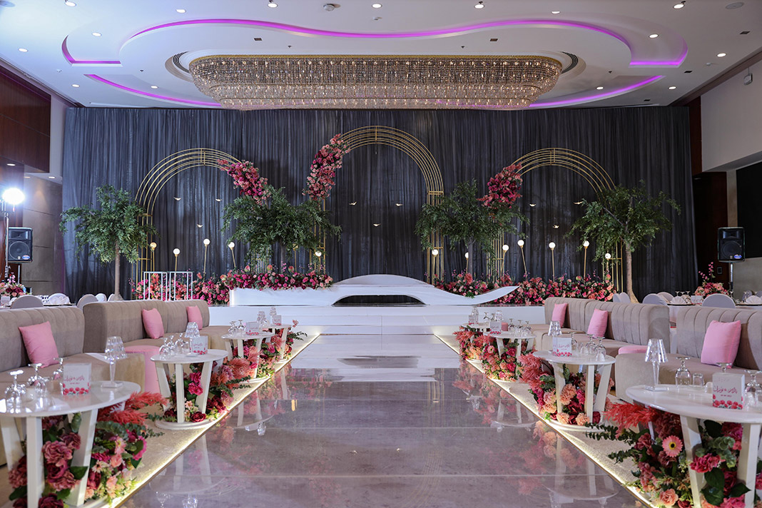Bridal entrance with stage and floral backdrop